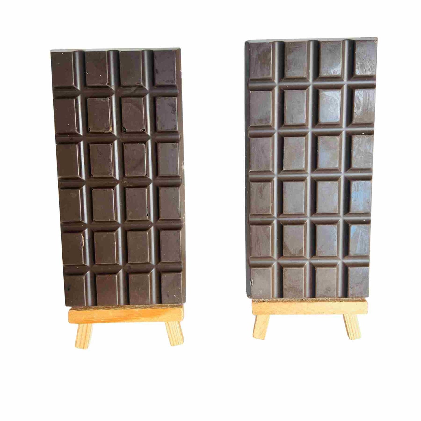 Chocolate bar-shaped speakers on stands with a white background