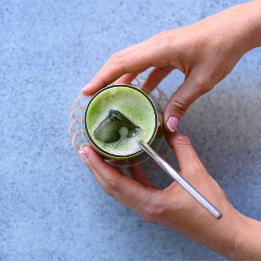 Hands holding Iced Matcha