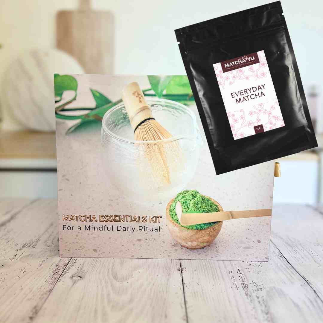 Matcha essentials kit with packaging and matcha powder on a wooden surface