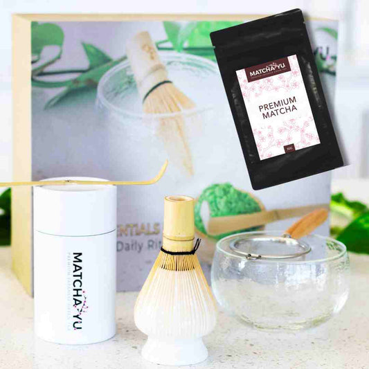 Matcha preparation set with Matcha-Yu packaging and tools on a light background