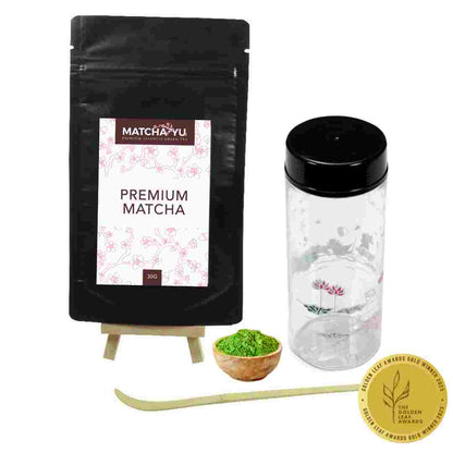 Matcha Yu premium matcha packaging with a scoop, bowl of matcha, and a jar on a white background.
